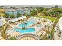 Beautiful aerial view of a pool area with lounge chairs and lush landscaping at 5802 Palmetto Dr # B314, Isle of Palms, SC 29451