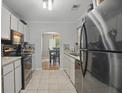 Charming kitchen with stainless steel appliances and tiled flooring at 607 Greencastle Dr, Goose Creek, SC 29445
