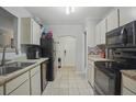 Galley kitchen featuring granite counters, tile backsplash, and modern appliances at 607 Greencastle Dr, Goose Creek, SC 29445