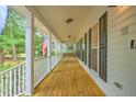 Inviting front porch with a swing offering a relaxing outdoor space at 100 Dacs Ln, Summerville, SC 29483