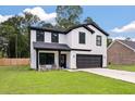 Charming two-story home with modern farmhouse design, white siding, black trim, and inviting front porch at 1000 Retreat Ave, Moncks Corner, SC 29461