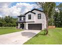 Charming two-story home with modern farmhouse design, white siding, black trim, and inviting front porch at 1000 Retreat Ave, Moncks Corner, SC 29461