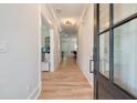 Inviting entryway featuring hardwood floors, neutral walls, and a view into the home's open layout at 1000 Retreat Ave, Moncks Corner, SC 29461