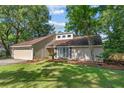 Attractive single-Gathering home with a lush green lawn and mature trees providing ample shade at 1129 Shady Grove Ln, Mount Pleasant, SC 29464