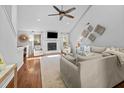 Bright living room with vaulted ceiling, fireplace, ceiling fan, and hardwood flooring at 1129 Shady Grove Ln, Mount Pleasant, SC 29464