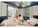 Sophisticated living room with unique lighting, comfortable seating, and stylish decor at 1407 Wando View St, Daniel Island, SC 29492