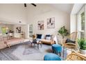 Bright living room boasting vaulted ceilings, large windows, and elegant furnishings at 1478 Diamond Blvd, Mount Pleasant, SC 29466