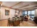 Bright open-concept living and kitchen area with wood beam details and modern furnishings at 1646 Marsh Harbor Ln, Mount Pleasant, SC 29464