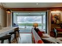 Cozy living area with a water view, comfortable seating, a bar, and access to the deck at 1646 Marsh Harbor Ln, Mount Pleasant, SC 29464