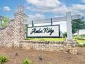 Azalea Ridge community entrance sign with brick pillars and lush landscaping at 165 Country Gate Ln, Summerville, SC 29485