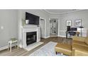 Comfortable living room with fireplace, TV, and stylish decor at 1735 Telfair Way, Charleston, SC 29412