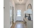 Hallway with wood flooring, decorative lighting, and convenient access to rooms at 306 Lucca Dr, Summerville, SC 29486