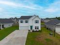 Beautiful two-story home with a well-kept lawn and a bright teal door, situated in a friendly community at 330 Bountiful Dr, Moncks Corner, SC 29461