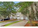 Attractive townhomes showing maintained lawns, private driveways, and lush landscaping at 4551 Great Oak Dr, North Charleston, SC 29418