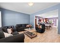 Spacious living area with hardwood floors, comfortable seating, and an open layout at 4938 Ballantine Dr, Summerville, SC 29485
