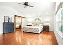 Bright main bedroom with hardwood floors, vaulted ceiling, and barn door closet at 51 Stocker Dr, Charleston, SC 29407