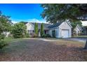 Charming single-story home with an attached garage and neatly kept lawn and landscaping at 5217 Copley Cir, Summerville, SC 29485