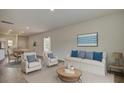 Inviting living room area filled with comfortable seating and bathed in natural light at 603 Quiet Valley Rd, Summerville, SC 29486
