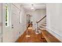 Inviting foyer with hardwood floors, traditional molding, and a staircase leading to the upper level at 712 Wakendaw Blvd, Mount Pleasant, SC 29464