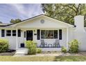 Inviting front porch with seating and decorative plants at 1032 Windward Rd, Charleston, SC 29412