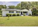 Charming home with a well-manicured front yard and solar panels at 1032 Windward Rd, Charleston, SC 29412