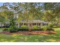 Beautiful brick home with a circular driveway and meticulously maintained landscaping at 108 E Walker Dr, Summerville, SC 29483