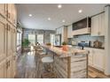 Modern kitchen featuring a spacious island with bar seating, stainless steel appliances, and natural light at 108 Wisteria Falls Ln, Saint Stephen, SC 29479