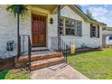 Charming front porch with brick steps, decorative railing, and a warm, welcoming entrance at 111 Circle Dr, Summerville, SC 29485