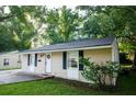 Inviting single-story home with a well-manicured lawn, complemented by vibrant greenery and a cozy entrance at 1137 Dickson Ave, Hanahan, SC 29410