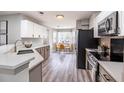 Well-lit kitchen featuring sleek stainless steel appliances, a breakfast nook with a view, and ample cabinet space at 1161 Monaco Dr, Mount Pleasant, SC 29464