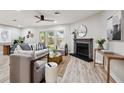Bright living room with modern fireplace, neutral tones, and sliding glass doors leading to backyard at 1161 Monaco Dr, Mount Pleasant, SC 29464