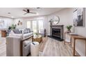 Bright and airy living room with modern decor, a cozy fireplace, and sliding doors to outdoor space at 1161 Monaco Dr, Mount Pleasant, SC 29464