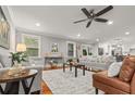 Bright living room with hardwood floors, neutral paint, ceiling fan, and modern decor at 1211 Dennis Blvd, Moncks Corner, SC 29461