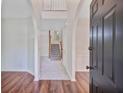 Bright foyer featuring hardwood flooring and staircase leading to the upper level at 1253 Horseshoe Bnd, Mount Pleasant, SC 29464