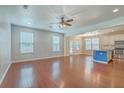 Open floor plan with hardwood floors seamlessly connecting the living room to the kitchen at 1350 Wild Goose Trl, Summerville, SC 29483