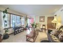 Bright living room featuring large windows and neutral decor, perfect for relaxation at 1430 Brian Rd, Charleston, SC 29407