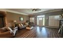 Bright living room featuring hardwood floors, large windows, and neutral decor at 148 Hidden Hills Rd, Cross, SC 29436