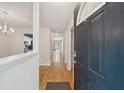Inviting entryway with hardwood floors offering views into the kitchen and living areas at 1505 Blaze Ln, Charleston, SC 29412
