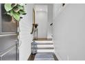 Inviting entryway features wood floors and a staircase at 1550 Spring Moss Rd, Mount Pleasant, SC 29466