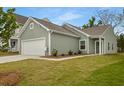 Attractive single-Gathering home with a two-car garage, tidy landscaping, and a welcoming entrance on a green lawn at 167 Surfbird Rd # 649P, Summerville, SC 29486