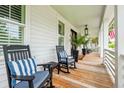 Relaxing front porch with classic rocking chairs, providing a cozy outdoor space for relaxation and leisure at 1903 Bolden Dr, Mount Pleasant, SC 29466