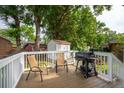 Cozy outdoor deck with seating and a grill, perfect for entertaining or relaxing at 2058 Bishop Dr, Charleston, SC 29414