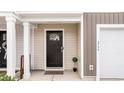 Inviting front entrance with a craftsman-style door and covered porch, perfect for a warm welcome at 266 Ivory Shadow Rd, Summerville, SC 29486