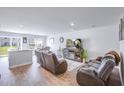 Spacious living room featuring hardwood floors and ample natural light, ideal for relaxation and entertainment at 266 Ivory Shadow Rd, Summerville, SC 29486