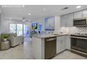 Bright, open kitchen with stainless steel appliances and a view into the living area at 2909 Atrium Villa, 9, Seabrook Island, SC 29455