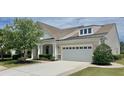 Charming home with a two-car garage and inviting front yard at 310 Waterlily Way, Summerville, SC 29486