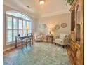 Cozy office space with large window, comfortable seating, and hardwood floors at 310 Waterlily Way, Summerville, SC 29486