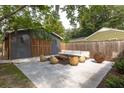 Outdoor seating area in backyard featuring modern furniture and a stylish rug at 5065 Durant Ave, North Charleston, SC 29405