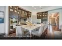 Open-concept kitchen boasts a large island with bar seating and stylish pendant lighting at 629 Marsh Cove Cir, Summerville, SC 29486