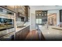 Modern kitchen featuring stainless steel appliances, granite countertops, and custom cabinetry at 629 Marsh Cove Cir, Summerville, SC 29486
